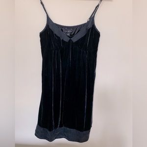Velvet navy dress, adjustable spaghetti straps, silk trim, sits above knee.